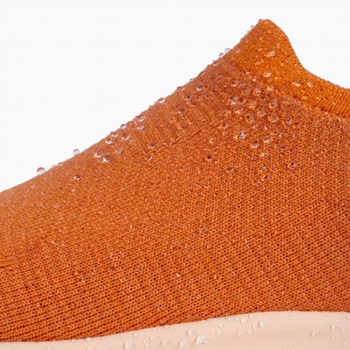 EVMoveSlipOn-Orange-DetailShot-Mid_c7e9984f-f5e3-4f78-a9b2-867c8746fb48.jpg